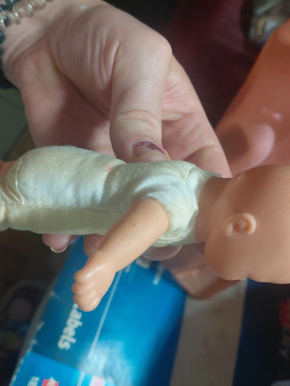 a vintage 1997 Corolle mini baby doll featuring blue eyes and a soft body.